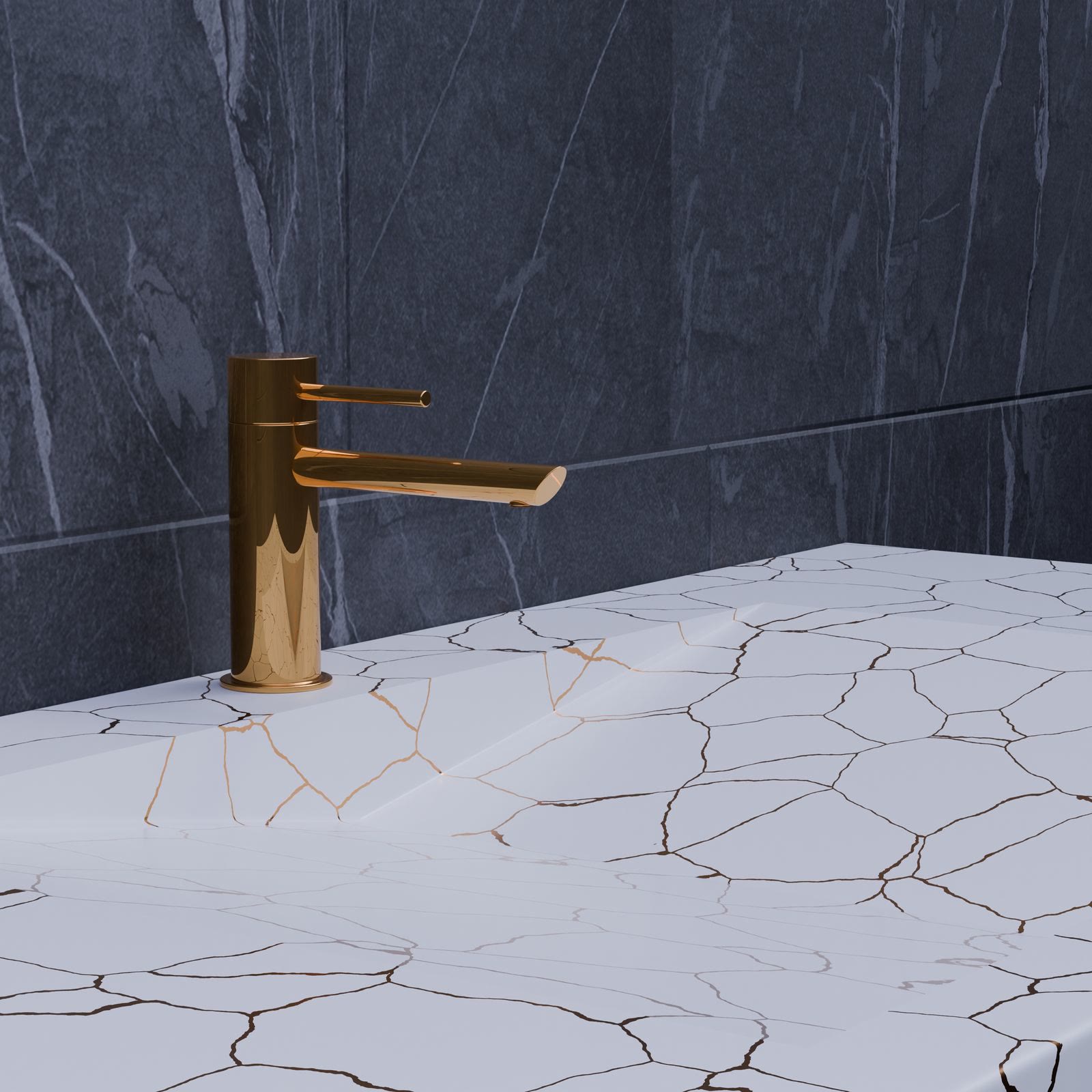 A gold tap on a white marble countertop