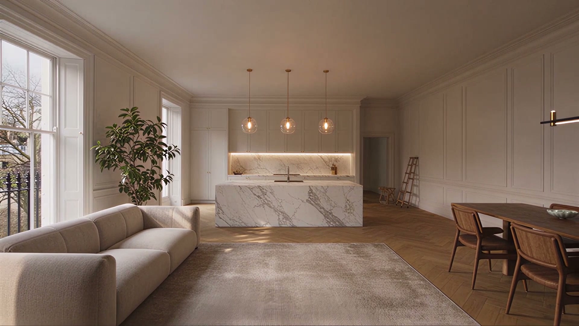 The finished room from our film: marble island, grey sofa, dining table and a plant by the window