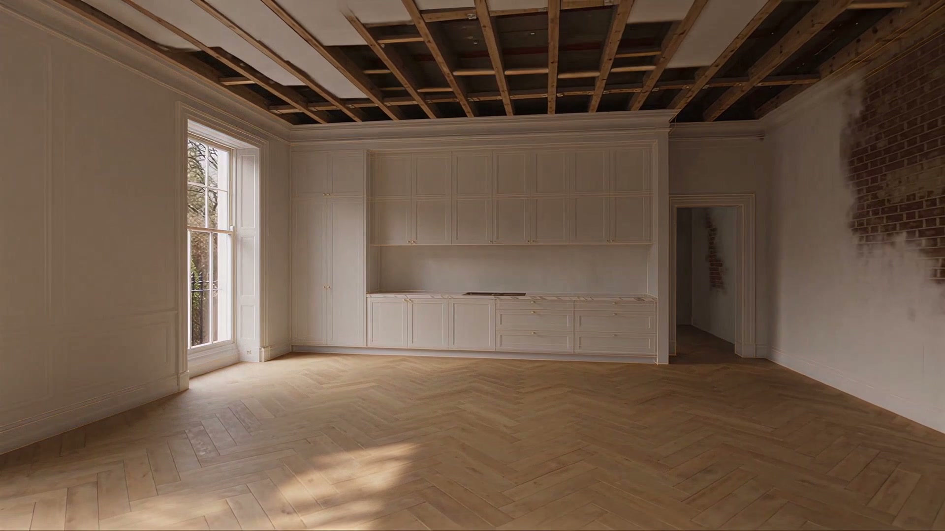 A freshly plastered room with white panelled walls and a herringbone floor