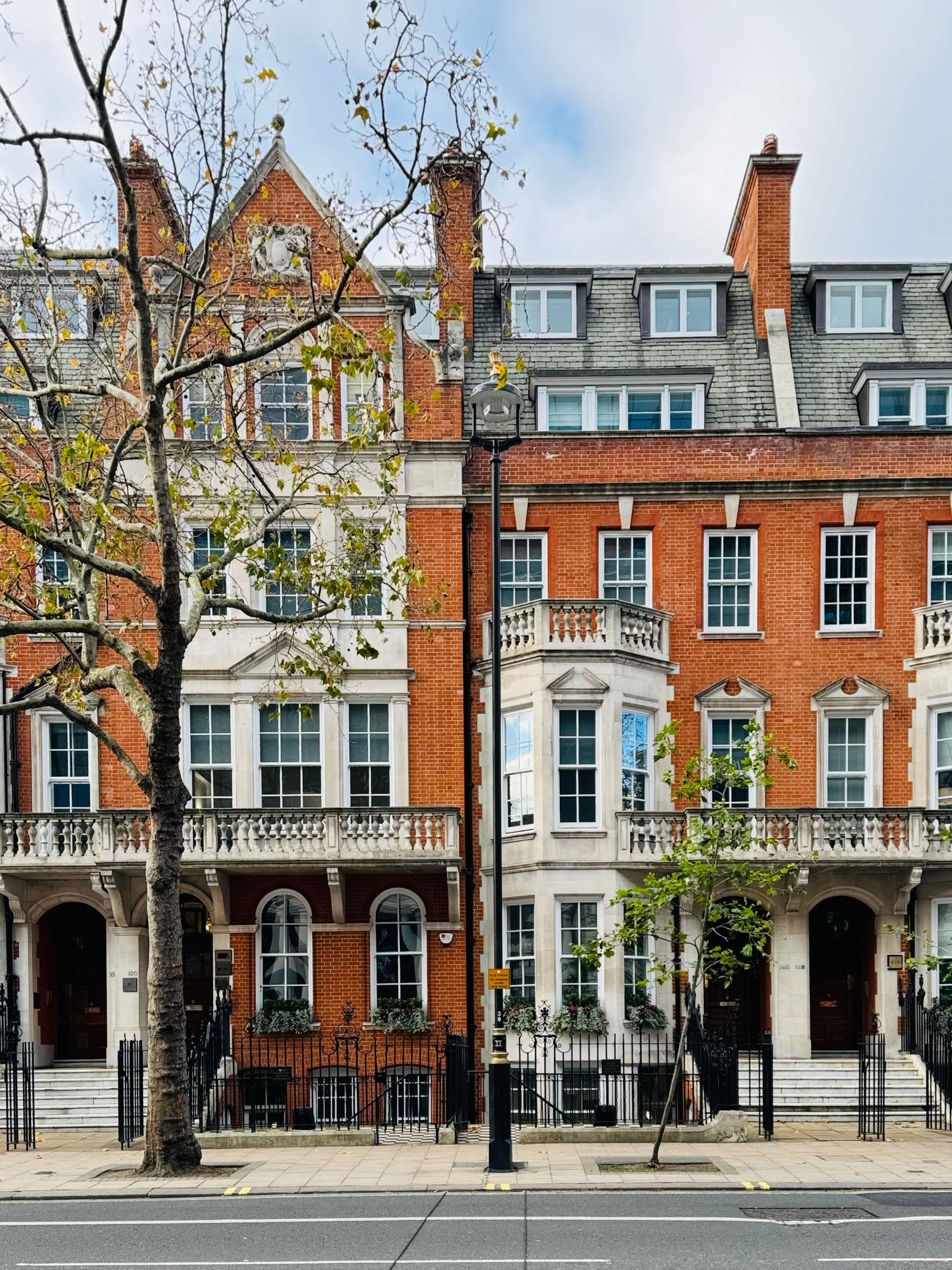 Traditional brick townhouses on a London street